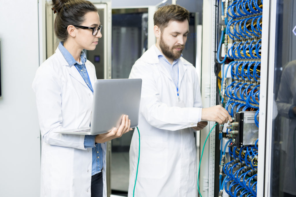 Technicians testing a complex server